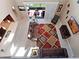 Overhead view of an open-concept living room with sofas, and a view of the outdoor screened-in lanai at 14172 Hutchinson St, Winter Garden, FL 34787