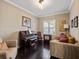 Inviting living room with a piano, dark wood floors, and comfortable seating at 14172 Hutchinson St, Winter Garden, FL 34787