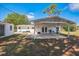 Backyard patio with a covered outdoor dining area, perfect for entertaining and enjoying outdoor meals at 1607 India Palm Dr, Edgewater, FL 32132