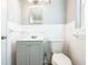 Updated bathroom features new vanity, classic white tiles and ample lighting at 1607 India Palm Dr, Edgewater, FL 32132