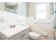 Charming bathroom features updated vanity, decorative mirror and ample lighting at 1607 India Palm Dr, Edgewater, FL 32132