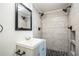 Bathroom featuring modern shower, sleek vanity, updated fixtures and tiling at 1607 India Palm Dr, Edgewater, FL 32132