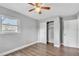 Cozy bedroom with hardwood floors, closet, white trim and fresh paint at 1607 India Palm Dr, Edgewater, FL 32132