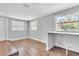 Cozy bonus room with hardwood floors, bar and natural light from windows at 1607 India Palm Dr, Edgewater, FL 32132