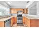 Charming kitchen features wood cabinets, stainless steel appliances, and lots of counter space at 1607 India Palm Dr, Edgewater, FL 32132