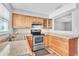 Charming kitchen features wood cabinets, stainless steel appliances, and lots of counter space at 1607 India Palm Dr, Edgewater, FL 32132