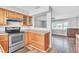 Charming kitchen features wood cabinets, stainless steel appliances, and lots of counter space at 1607 India Palm Dr, Edgewater, FL 32132