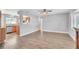 Open living room featuring hardwood floors, and a view to the kitchen at 1607 India Palm Dr, Edgewater, FL 32132