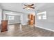 Open living room featuring hardwood floors, a ceiling fan with an eat-in kitchen at 1607 India Palm Dr, Edgewater, FL 32132