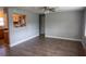 Spacious living room with neutral walls, modern flooring, and a view into the kitchen at 1607 India Palm Dr, Edgewater, FL 32132