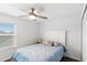 Cozy bedroom with a ceiling fan, a window letting in natural light, and a comfortable-looking bed at 1696 Tohoqua Blvd, Kissimmee, FL 34744