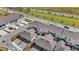 Aerial view of newly built townhomes, each with a private garage and small patio area, in a modern community at 1696 Tohoqua Blvd, Kissimmee, FL 34744