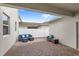 Covered patio with brick flooring and cozy outdoor seating area at 1696 Tohoqua Blvd, Kissimmee, FL 34744
