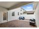 Inviting outdoor patio featuring stylish seating and a brick-paved floor, perfect for relaxation and entertaining at 1696 Tohoqua Blvd, Kissimmee, FL 34744