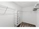 Functional walk-in closet with wire shelving and a hanging organizer, offering ample storage space at 1696 Tohoqua Blvd, Kissimmee, FL 34744