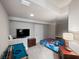 Basement area offering a tv, pool table, bed and desk with a study area at 1707 Stetson Ct, Longwood, FL 32779