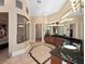 Luxurious bathroom featuring granite counters, dual vanities, walk-in shower, and tile flooring at 1707 Stetson Ct, Longwood, FL 32779