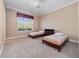 Bedroom featuring two twin beds, neutral walls, large window, and a ceiling fan at 1707 Stetson Ct, Longwood, FL 32779
