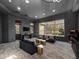 Well-appointed game room with stylish decor, large windows, and ample seating at 1707 Stetson Ct, Longwood, FL 32779