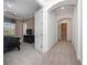 Hallway and bedroom featuring neutral walls, carpet, arched doorways, and a ceiling fan at 1707 Stetson Ct, Longwood, FL 32779