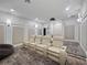 Cozy home theater with luxury seating, surround sound, and ambient lighting at 1707 Stetson Ct, Longwood, FL 32779