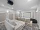 Home theater with comfortable seating, plush carpeting, and state-of-the-art projection system at 1707 Stetson Ct, Longwood, FL 32779