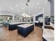 Expansive kitchen featuring dark cabinets, double islands with marble tops, stainless appliances, and ample lighting at 1707 Stetson Ct, Longwood, FL 32779