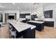 Spacious kitchen featuring dark blue cabinets, a double island with marble countertops, and modern pendant lighting at 1707 Stetson Ct, Longwood, FL 32779