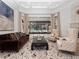 Spacious living room featuring a large window, a fireplace, and elegant furniture at 1707 Stetson Ct, Longwood, FL 32779