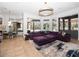 Inviting living room with stylish sectional, modern lighting, and views of the outdoor pool area at 1707 Stetson Ct, Longwood, FL 32779
