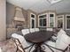 Covered outdoor kitchen boasts built-in grill, bar seating, and spacious dining area at 1707 Stetson Ct, Longwood, FL 32779