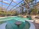 Enjoy a refreshing swim in this inviting pool featuring a swim-up table and waterfall feature at 1707 Stetson Ct, Longwood, FL 32779