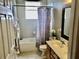 Cozy bathroom features a shower and tub combination, a double vanity, and neutral-toned walls at 1838 Palmerston Cir, Ocoee, FL 34761