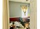 Untidy bedroom with gray and red walls, a desk, and a ceiling fan at 1838 Palmerston Cir, Ocoee, FL 34761