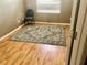 Bedroom features wood floor, window and an area rug at 1838 Palmerston Cir, Ocoee, FL 34761