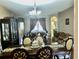 Dining room with elegant furniture and decorative accents, adjacent to a living area at 1838 Palmerston Cir, Ocoee, FL 34761