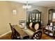 Elegant dining room featuring a large wooden table and chairs with a gorgeous glass China cabinet at 1838 Palmerston Cir, Ocoee, FL 34761