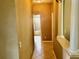 Hallway with tile flooring leading to a bathroom with a tub, complemented by decorative columns at 1838 Palmerston Cir, Ocoee, FL 34761