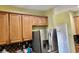 Well-appointed kitchen featuring stainless steel appliances, granite countertops, and wooden cabinets at 1838 Palmerston Cir, Ocoee, FL 34761