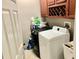 This well-lit laundry room is equipped with modern washer and dryer units and overhead cabinets at 1838 Palmerston Cir, Ocoee, FL 34761
