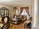 Open living space adjacent to the dining area, featuring classic decor and hardwood floors at 1838 Palmerston Cir, Ocoee, FL 34761