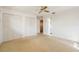 Neutral bedroom with closet storage, ceiling fan, and neutral carpet at 1873 Poinciana Rd, Winter Park, FL 32792