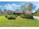 Charming one-story home with mature landscaping, a green lawn, and a well-maintained exterior at 1873 Poinciana Rd, Winter Park, FL 32792