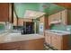 Cozy kitchen featuring light wood cabinets, solid surface counters, and a full appliance package at 1873 Poinciana Rd, Winter Park, FL 32792