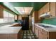 Bright kitchen featuring wood cabinets, a window over the sink, and a full appliance package at 1873 Poinciana Rd, Winter Park, FL 32792