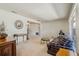 Open-concept living area featuring neutral walls and carpet, seamlessly connecting to adjacent spaces at 1873 Poinciana Rd, Winter Park, FL 32792
