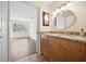 Bathroom featuring a granite-topped vanity with wooden cabinets, with tile flooring at 205 Hill St # 205, Casselberry, FL 32707