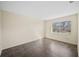 An empty bedroom featuring tile floors, and a window providing natural light at 205 Hill St # 205, Casselberry, FL 32707