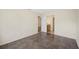 A bright bedroom with tile floors and an entrance to a bathroom and another room at 205 Hill St # 205, Casselberry, FL 32707