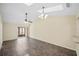 Spacious living room featuring tile flooring, a ceiling fan, and natural light from the doorway at 205 Hill St # 205, Casselberry, FL 32707